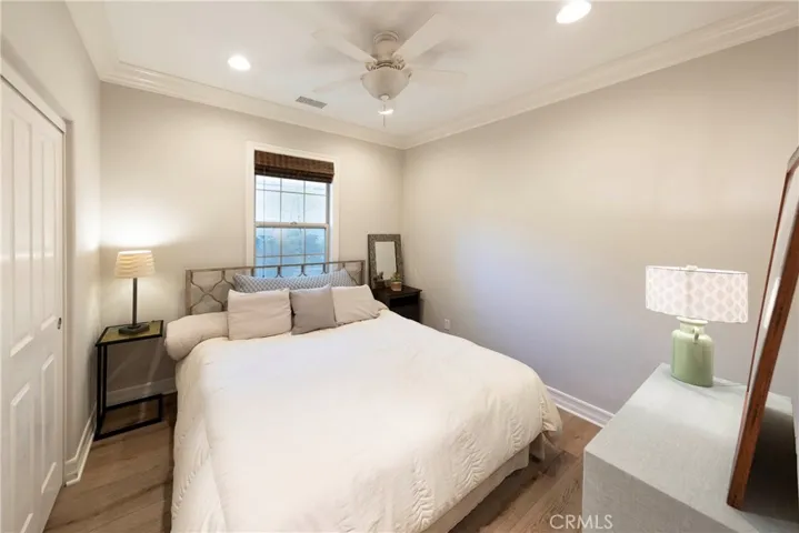 Originally tandem garage, builder converted into downstairs bedroom with closet accommodating a king-size bed