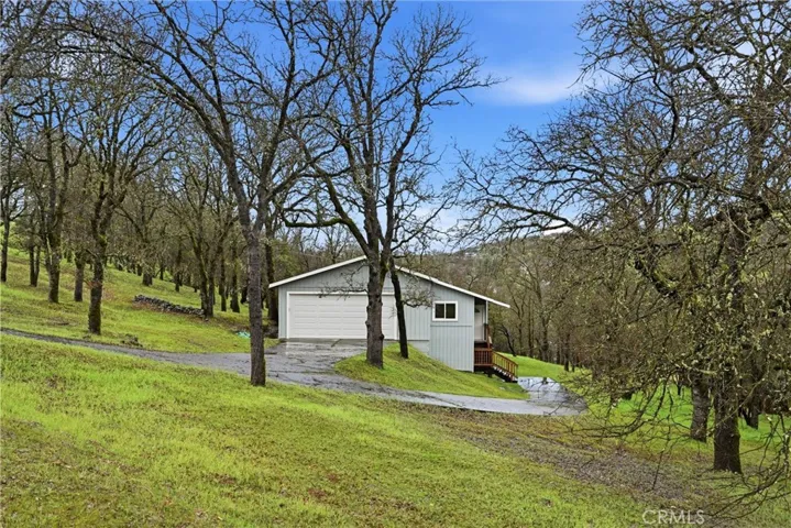 Lovely wooded setting on quiet side street in Hidden Valley Lake.