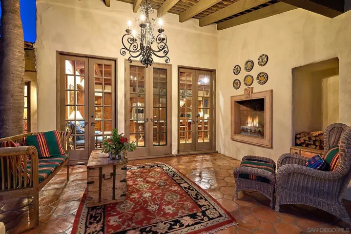 Indoor/Outdoor living with fireplace off the kitchen.