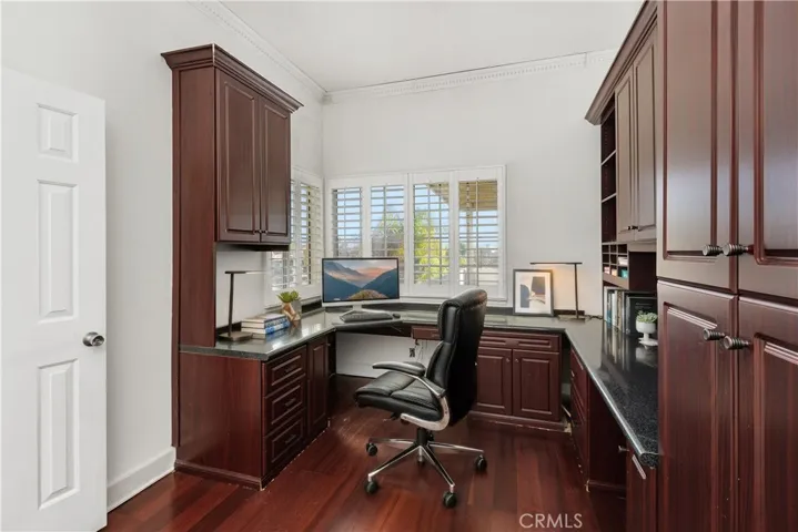 Dedicated interior workspace with built-in cabinetry, ideal for working from home