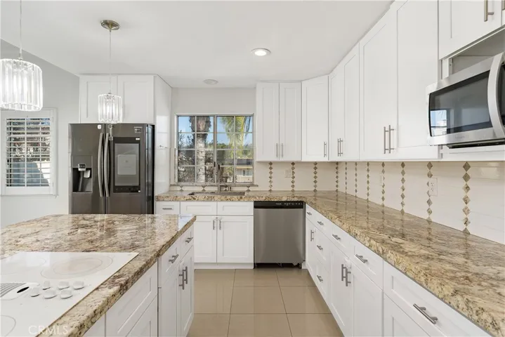 Large kitchen island with plenty of prep space, ideal for hosting and everyday use
