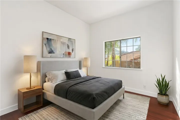 Comfortable guest bedroom with bright natural light and a versatile layout