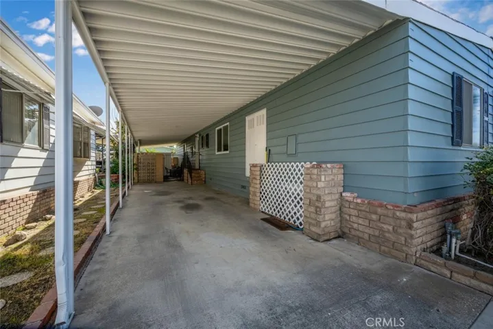Carport with access to back porch patio entrance