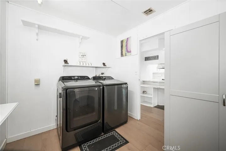 Laundry room features access to private back patio