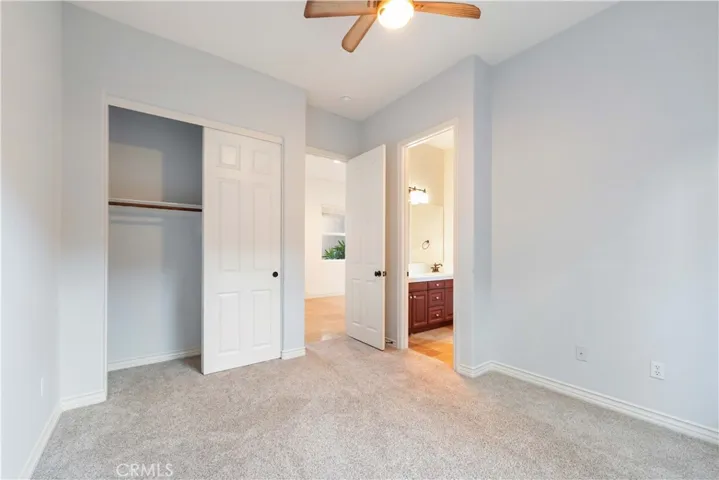 Bedroom #2 with a 2 door closet & is attached to a full bathroom.