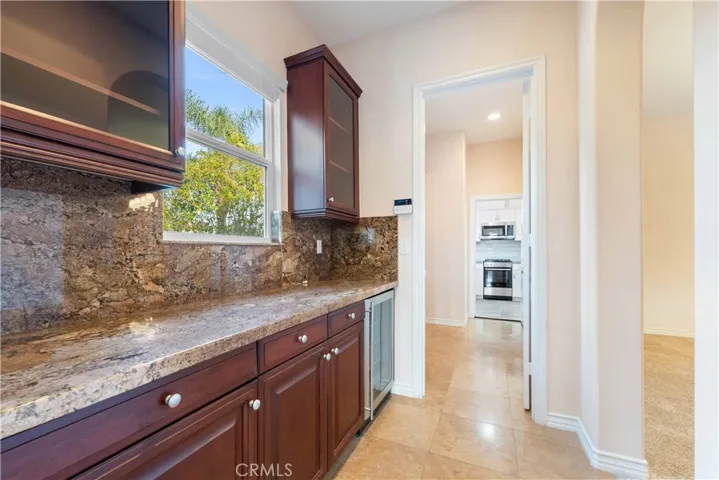 Prep station next to the kitchen with wine & drinks fridge.