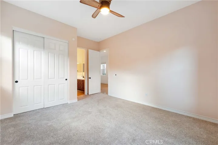 Bedroom #3 with a double closet & a ceiling fan