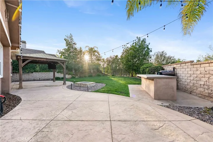 Private backyard with gazebo, BBQ & bar area & plenty of room for seating & entertaining