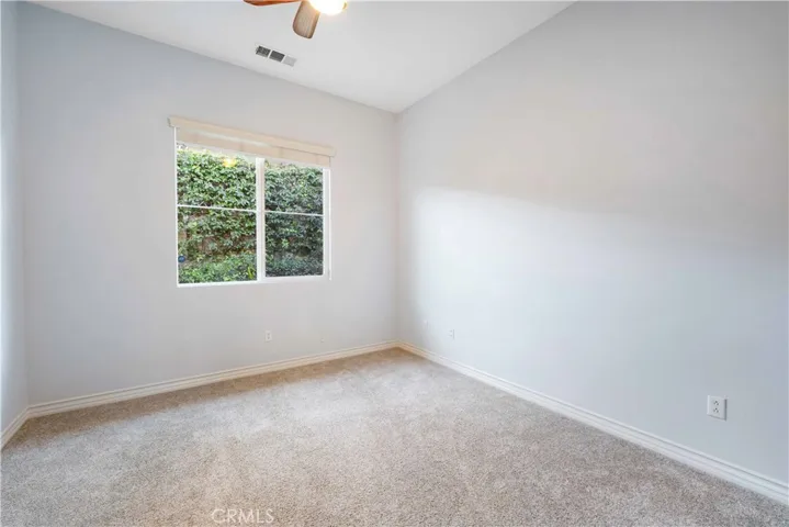 Bedroom #2 with a ceiling fan, double door closet & attached to a full bath.