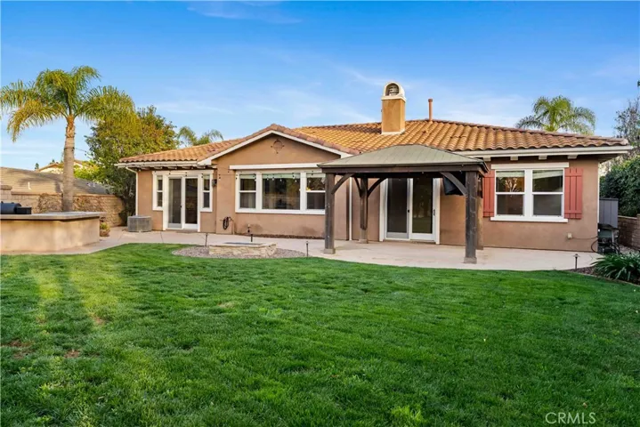 Gazebo with lights & an attached television, fire pit with