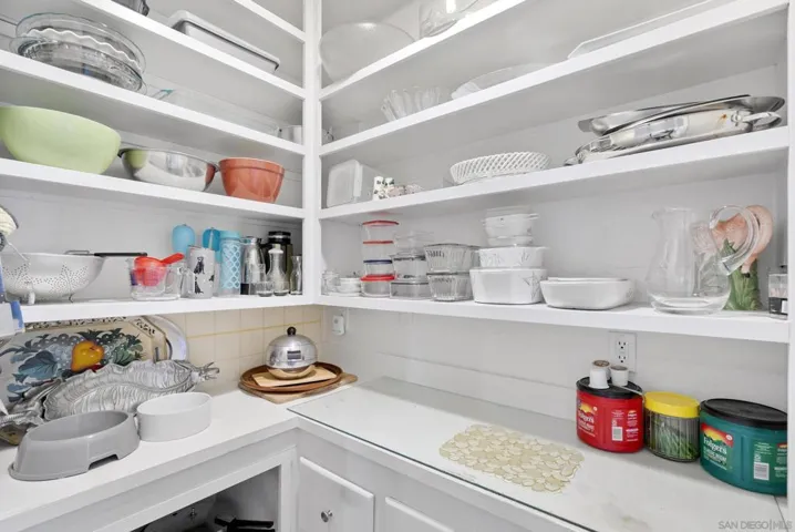 Pantry with lots  of room to store extra appliances, food plates, bowls, plates, etc
