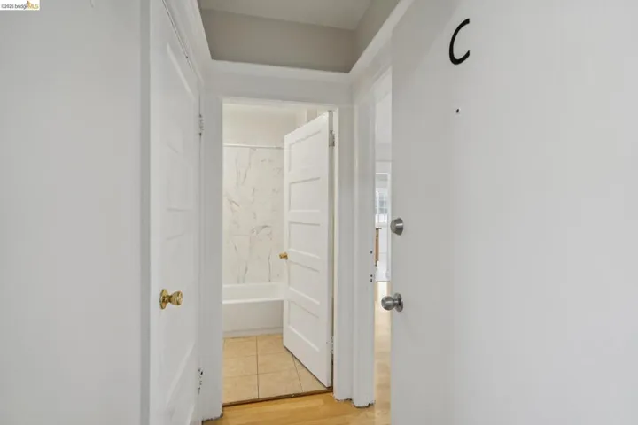 Hallway featuring light wood finished floors
