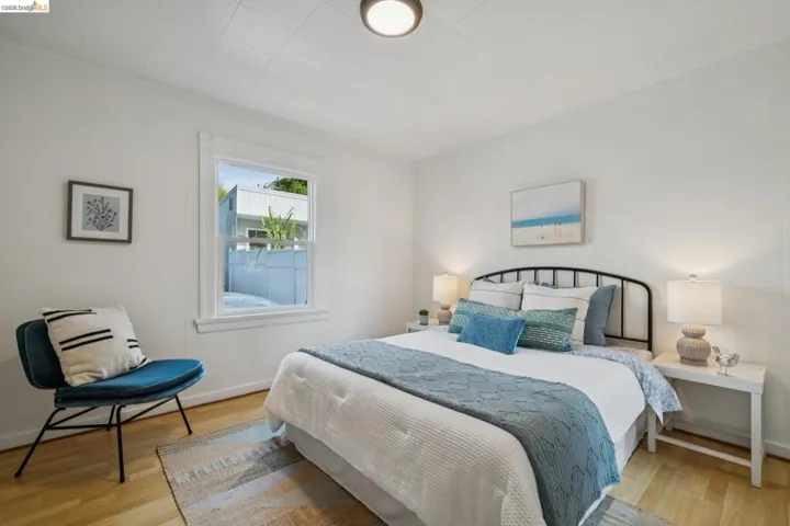 Bedroom featuring light wood finished floors and baseboards