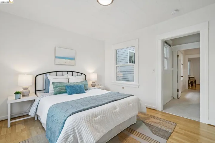 Bedroom featuring light wood finished floors and baseboards