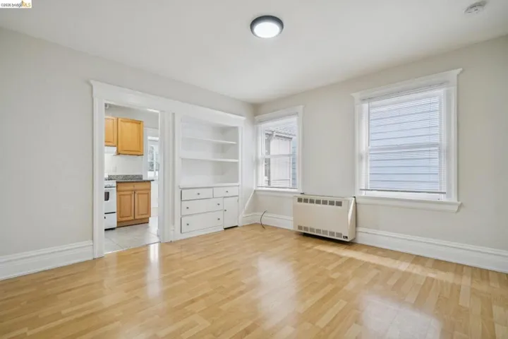 Unfurnished bedroom with light wood-type flooring