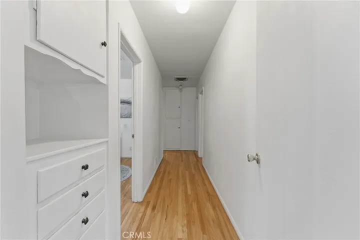 hallway going to the 3 bedrooms