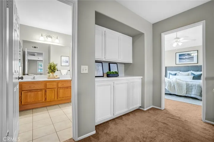 Convenient built-in cabinetry offering additional upstairs storage and display space