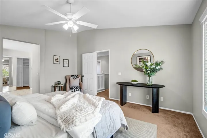 Spacious primary bedroom offering room for a seating area and easy access to the en-suite bath