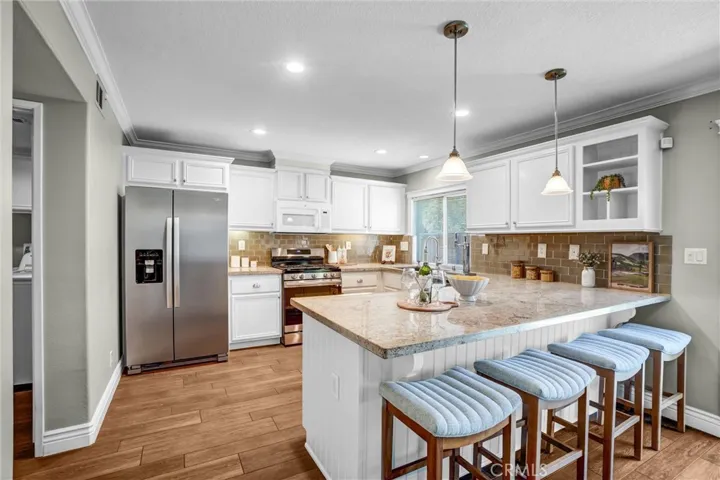 Well-appointed kitchen with breakfast bar seating and generous counter space
