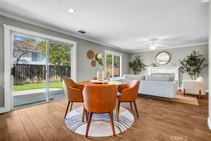 Casual dining space adjacent to the kitchen with backyard views