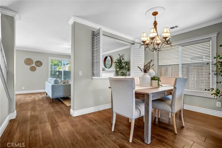 Dining area with sightlines to the entry and living room creating an open, connected layout