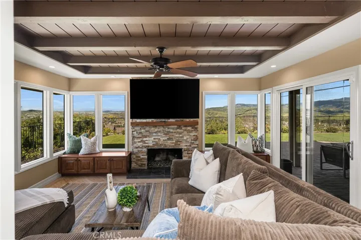 Family room with one of two gas fireplaces