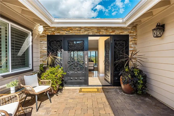 Iron entry doors with operable screened windows