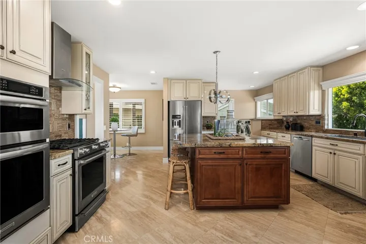 The kitchen features a large island plus full breakfast nook (some have converted this space to a charming home office)