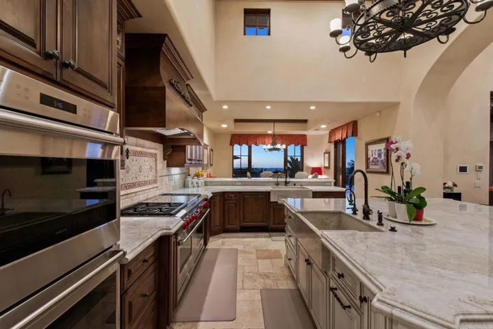 Side by side refrigerator, double wolf ovens, 6 burner wolf stove with French cook top.