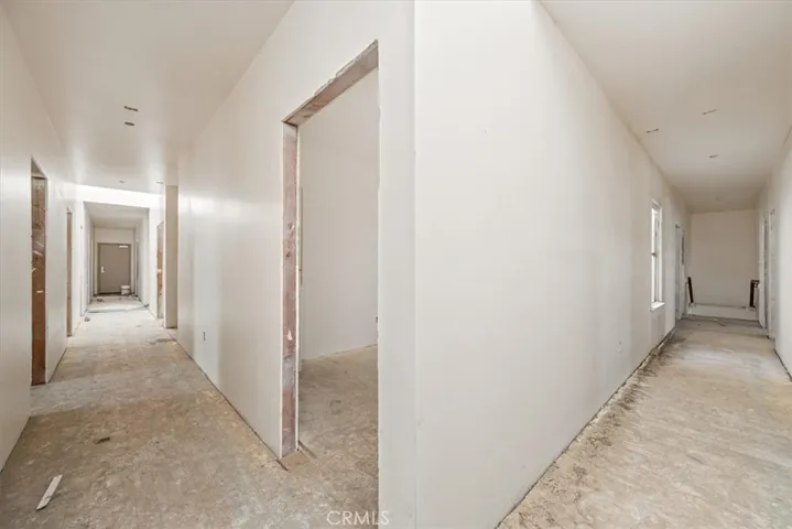 Left - east/west hallway to 2nd floor extrerior door; Right - north/south hallway to stairs