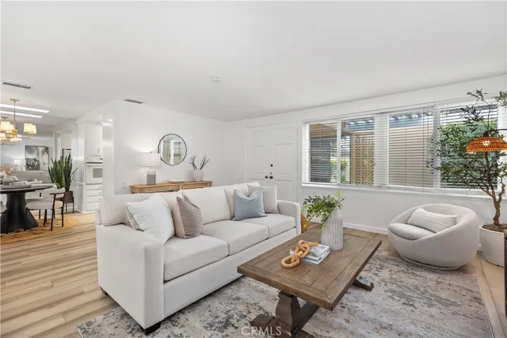 Light & Bright View of Living Room into Dining Room