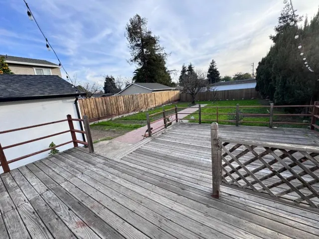 Outdoor patio deck. Large backyard.