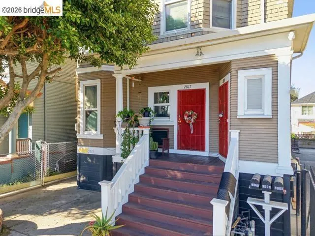 View of exterior entry with covered porch