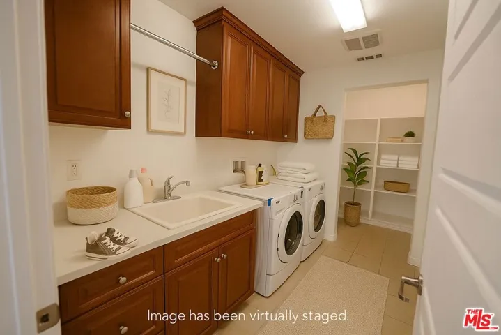 upstairs laundry with sink and