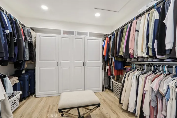 Roomy walk-in closet with built-in organizers