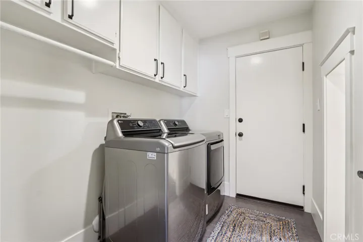 Laundry room with built-in cabinetry