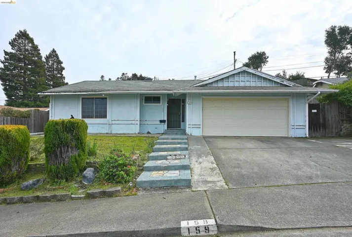 Single story home with a garage and driveway