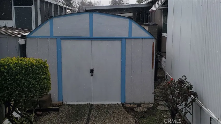 View of storage shed in back yard.