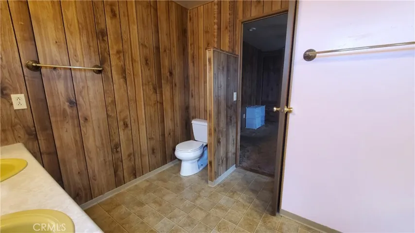 View of large master bathroom with double sink vanity.