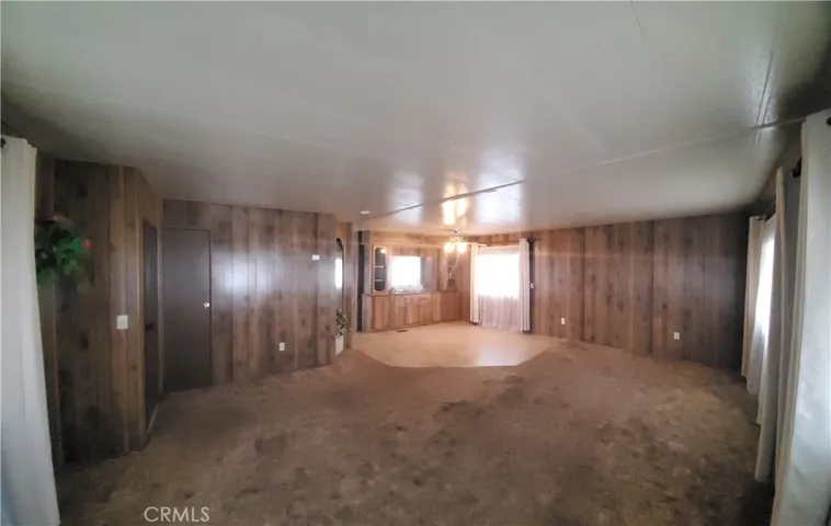 View of large living room area and dining room area.