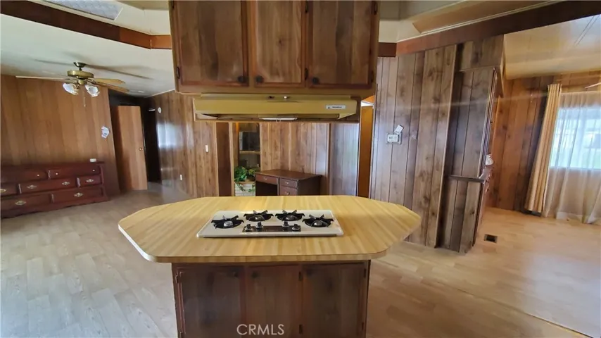 View of kitchen cook island overlooking family room area.