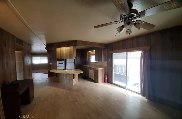 View of kitchen & family room area with slider to covered porch area.