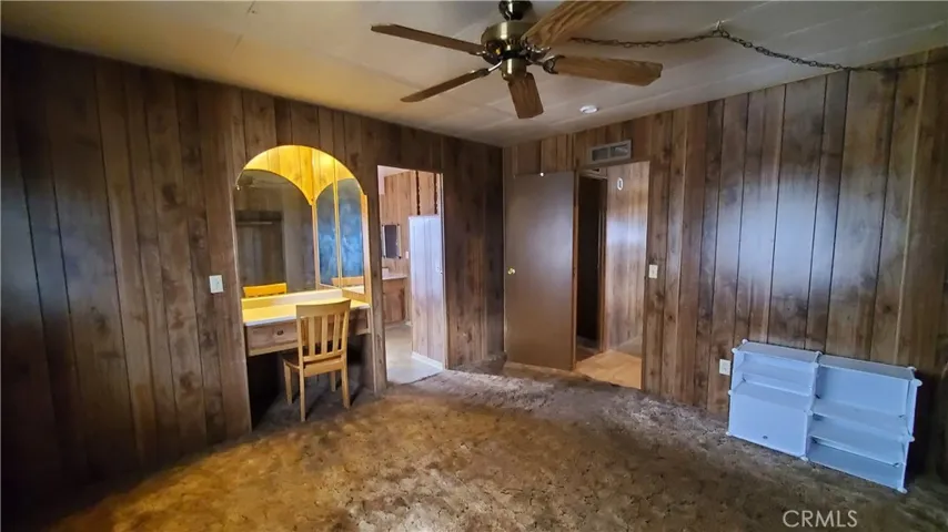 View of master bedroom with built in desk station.
