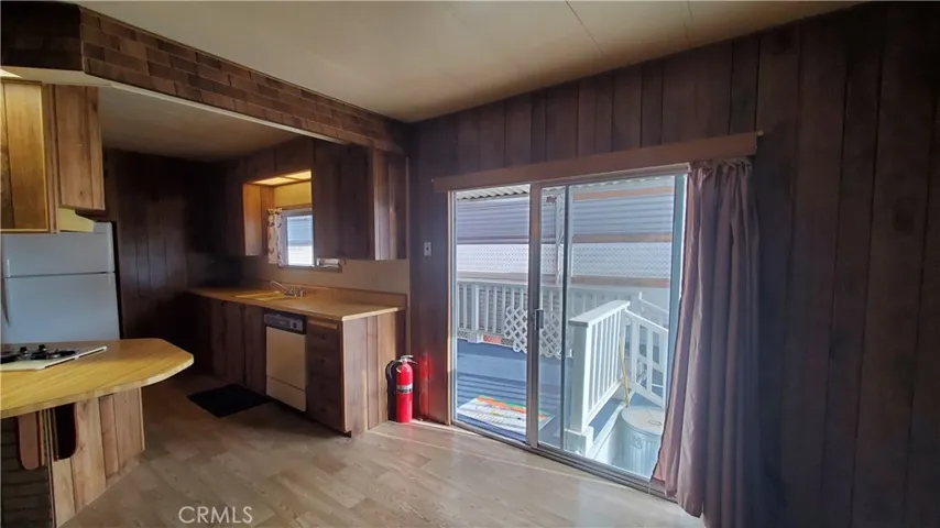 View of slider in family room and kitchen area.