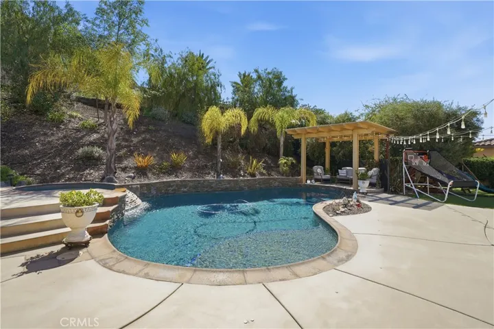 Stack stone adorns the pool in your private backyard.