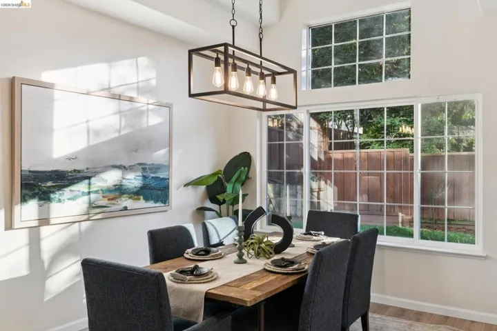 Dining space featuring baseboards and wood finished floors