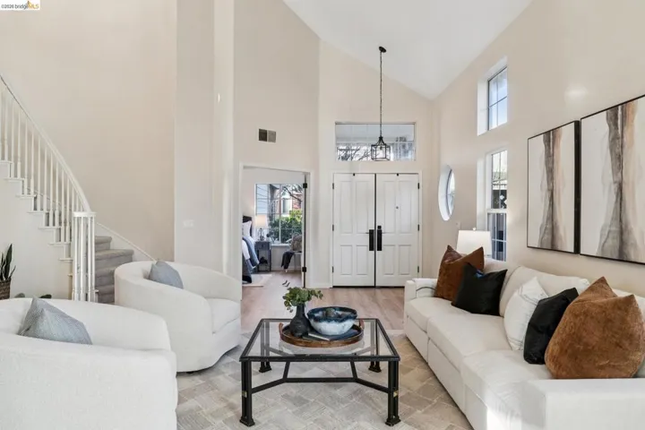 Living area featuring vaulted ceiling and wood finished floors