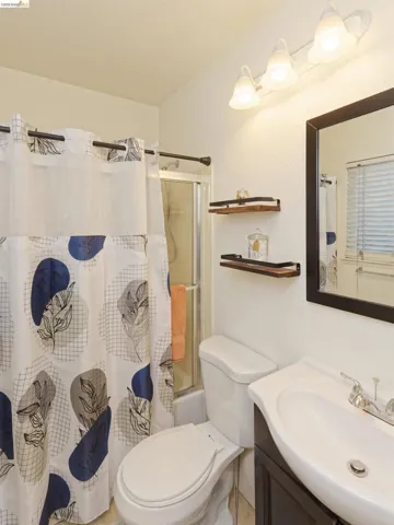 Bathroom featuring vanity and shower / tub combo