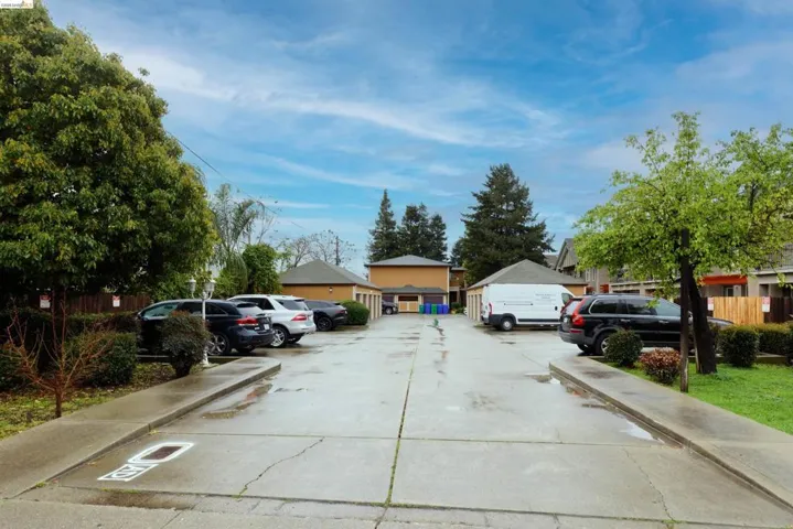 View of concrete road featuring sidewalks and a residential view