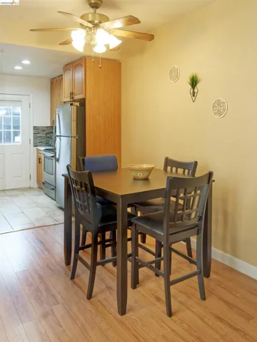Dining area featuring ceiling fan, light wood-style floors, and recessed lighting